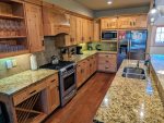 Fully equipped kitchen with granite countertops. 